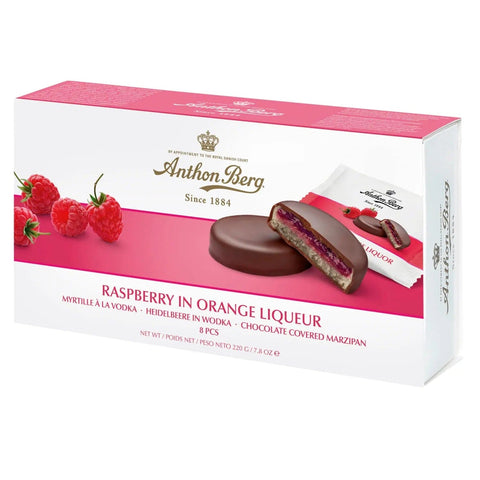 Anthon Berg raspberry in orange liqueur marzipan dipped in dark chocolate, presented on a plain background.