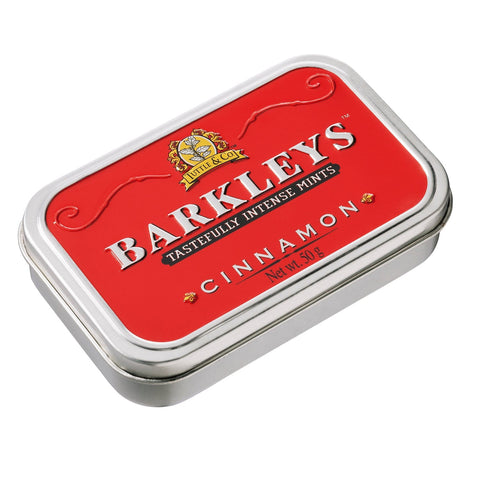 Jag Couture London-New York Barkleys classic cinnamon mints in a luxurious tin, showing the round cinnamon mints inside the elegant packaging.