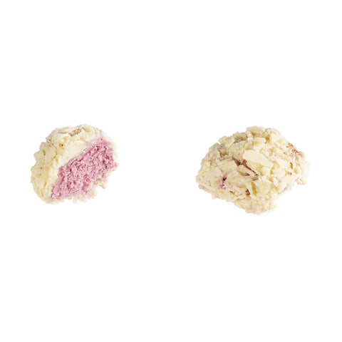 Blackcurrant truffle by Jag Couture London with white flaked truffle and dark blue blackcurrant paste filling, 13g.