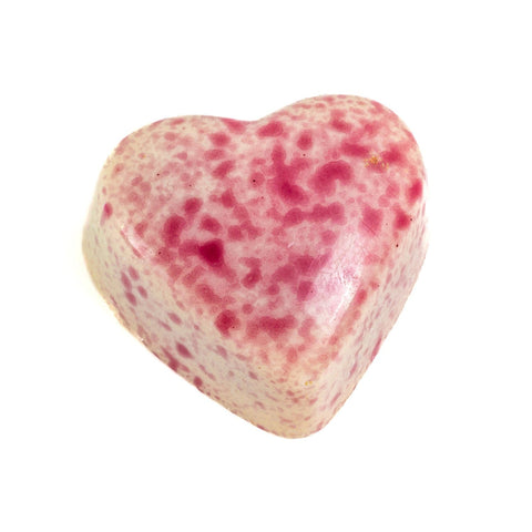 White chocolate Blushed Heart by Jag Couture London filled with passion fruit ganache, shown in a close-up image.