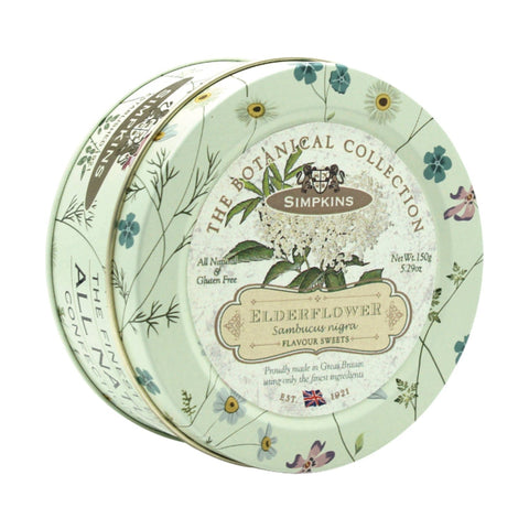 Botanical tin of elderflower flavored travel sweets by Jag Couture London New York, featuring floral design and colorful candies inside.