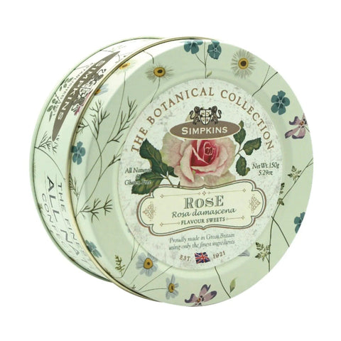 Botanical tin of rose-flavored travel sweets by Jag Couture London - New York, featuring floral design and colorful candies inside.