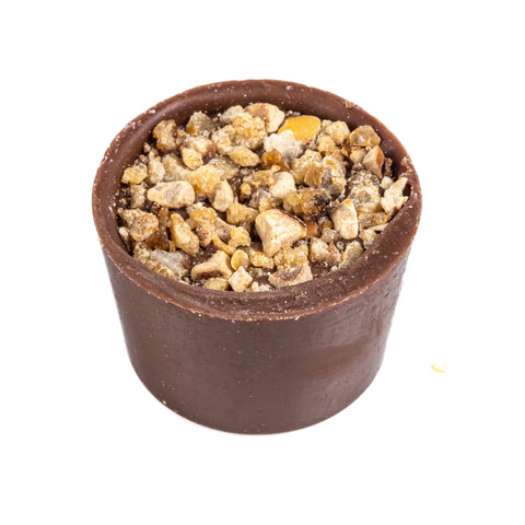 Jag Couture London butter caramel in a milk chocolate cup topped with roasted hazelnuts, 13.7g.