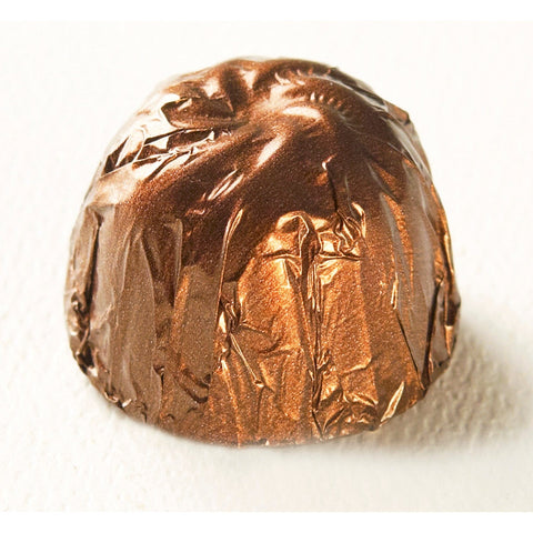 Jag Couture London Butter Scotch caramel covered in milk chocolate, 14.8g, showcasing the soft, buttery texture and rich chocolate coating.