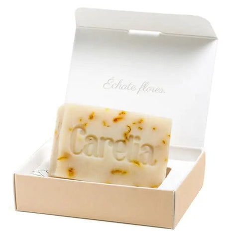 Carelia Botanical and Artisan Soap by Jag Couture London features organic calendula in a 100g bar, showcasing natural ingredients.