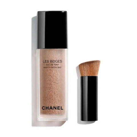 Chanel Les Beiges Eau De Teint Medium 30ml bottle with beige cap and elegant packaging, displayed on a neutral background.