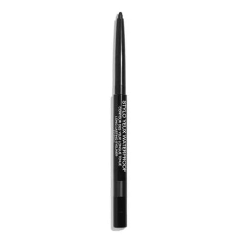 Chanel Stylo Yeux Waterproof 48-Or Antique eyeliner pencil with gold and brown shade, held in hand against a neutral background.