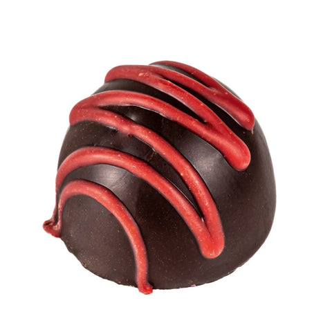 Cherry fruit cream flavored fondant in dark chocolate, 13g, by Jag Couture London New York, shown in a close-up image.