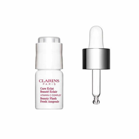 Clarins Beauty Flash Fresh Ampoule 8ml by Jag Couture London - New York, close-up of the small skincare ampoule bottle.