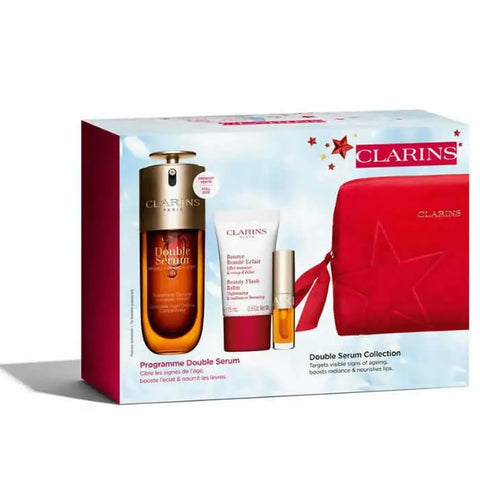 Set of four Clarins Double Serum 50ml bottles from Jag Couture London - New York, featuring sleek glass packaging and serum labels.
