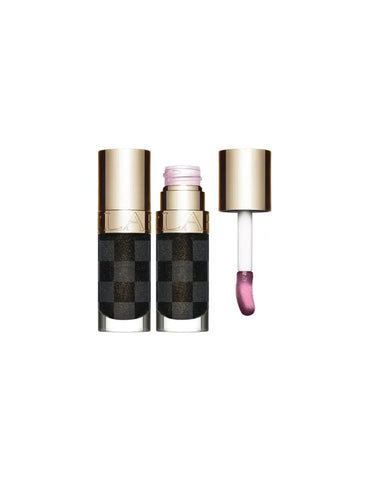 Clarins Lip Comfort Oil in Black, 7ml, limited edition lip oil by Jag Couture London New York, with a sleek black packaging.