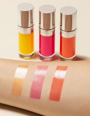 Clarins Lip Comfort Oil Power Of Colors Aceite De Labios Ed Lim in 23, 7ml, featuring a sleek applicator and vibrant lip oil color.