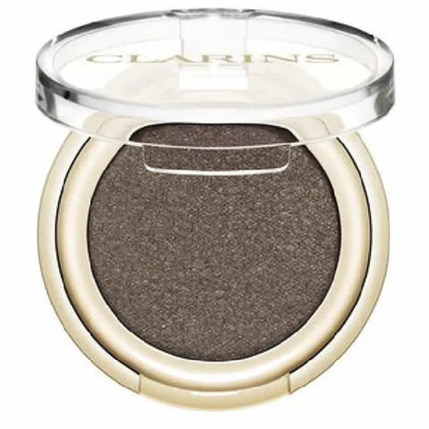Clarins Ombre Skin 06 Satin Mocha eyeshadow in a sleek compact, showcasing warm brown and mocha shades for eye makeup.