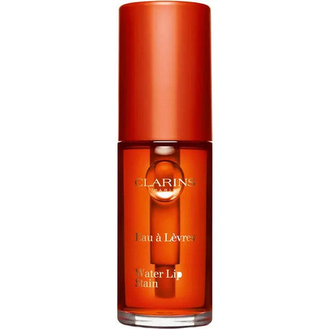Clarins Water Lip Stain in shade 02 Orange Water, a vibrant liquid lip color from Jag Couture London - New York.