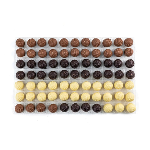 Assorted milk, dark, and white cream truffles from Jag Couture London - New York, part of the Classic English Truffle Selection.