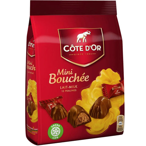 Jag Couture London New York Cote d'Or milk chocolate mini bouchees in a pouch, showcasing rich milk chocolates with a smooth texture.