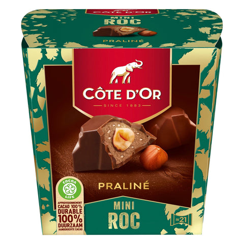 Cote d'Or Mini Roc Praline by Jag Couture London features smooth milk chocolate with a whole hazelnut, praline, and crispy pieces.