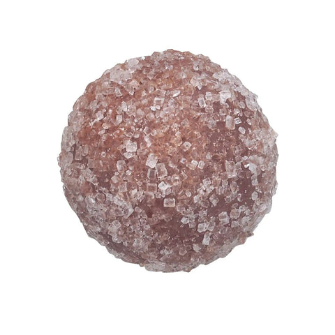 Jag Couture London New York Crème Brûlée truffle, milk chocolate with caramelized sugar coating, 12g, close-up of the chocolate treat.