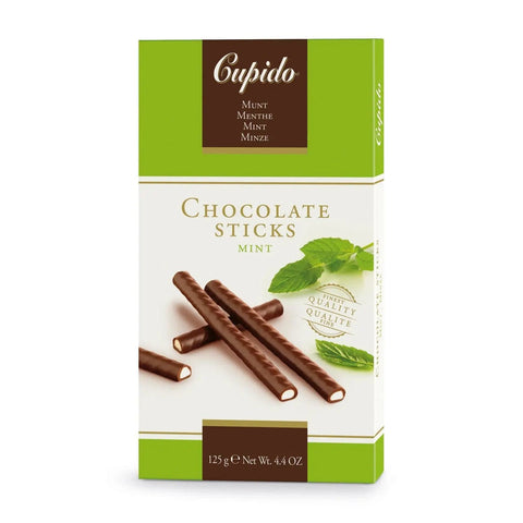 Jag Couture London New York Cupido dark chocolate mint sticks, close-up of chocolate-covered mint candies on a white background.