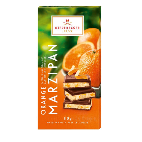 Dark chocolate covered orange flavored marzipan bar by Jag Couture London New York, with a smooth chocolate coating over marzipan.