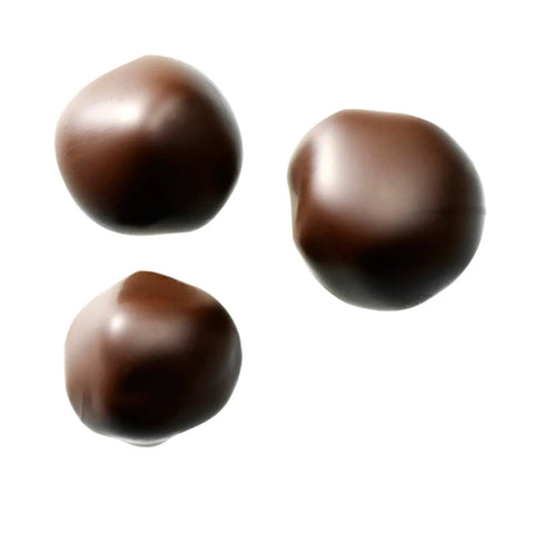 Dark ginger confection enrobed in dark chocolate from Jag Couture London New York, showcasing a rich, glossy finish.