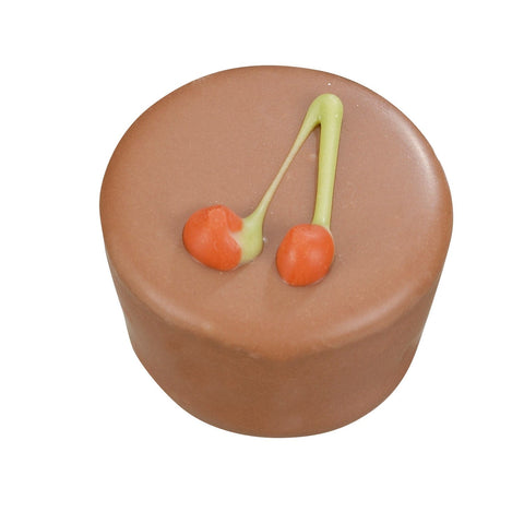 Amarena milk chocolate ganache filled with cherry syrup, 20.5g, by Jag Couture London New York, showing a close-up of the chocolate treat.