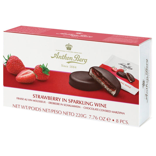Anthon Berg strawberry in sparkling wine marzipan wrapped in dark chocolate, presented on a decorative plate.