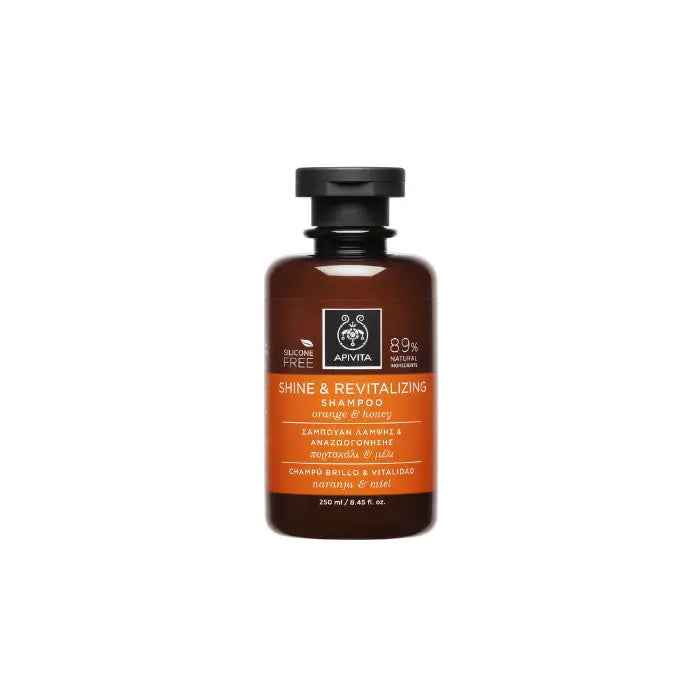 Jag Couture London New York Apivita Shine and Revitalizing Shampoo with Orange and Honey, 250ml, in a clear bottle.