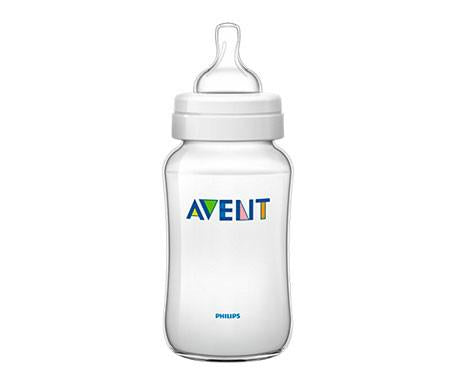 Avent Classic 330ml baby bottle by Jag Couture London - New York, with clear plastic body and blue silicone nipple on a white background.