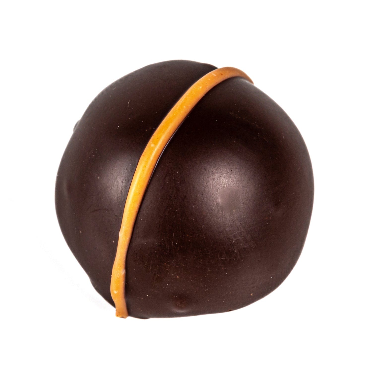 Piece of dark chocolate filled with Bucks Fizz crème, containing Marc de Champagne and orange crème fraîche, by Jag Couture London.
