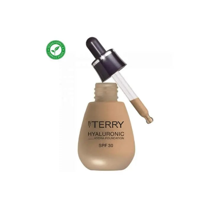 By Terry Hyaluronic Hydra-Foundation SPF30 in 500N Medium Dark, featuring a sleek bottle with pump dispenser.