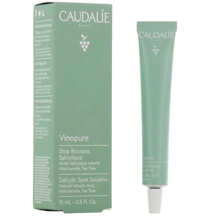 Caudalie Vinopure Salicylic Spot Solution 15ml, a clear bottle with dropper for targeted blemish treatment.