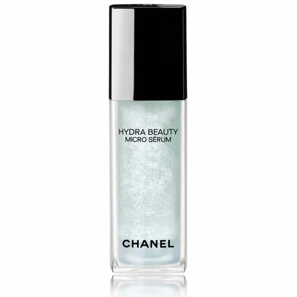 Chanel Hydra Beauty Micro Serum 30ml bottle, clear glass with pump dispenser, on a neutral background.