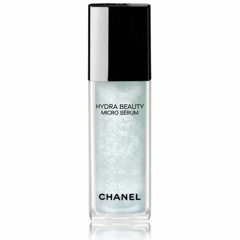 Chanel Hydra Beauty Micro Serum 30ml in a clear glass bottle with a pump dispenser, displayed on a neutral background.