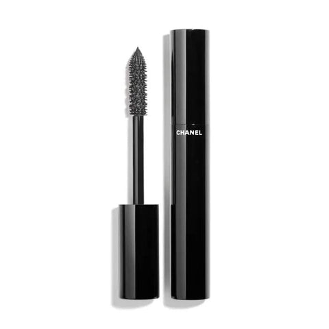 Chanel Le Volume De Chanel Waterproof Mascara in 10 Noir with a sleek black tube and wand applicator on a white background.