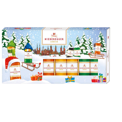 Christmas Marzipan Classics in a festive box featuring pistachio, orange, pineapple, and espresso flavors by Jag Couture London New York