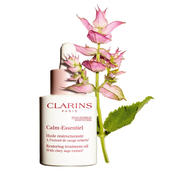 Clarins Calm-Essentiel Restoring Treatment Oil 30ml in a clear glass bottle, designed for soothing and restoring skin.