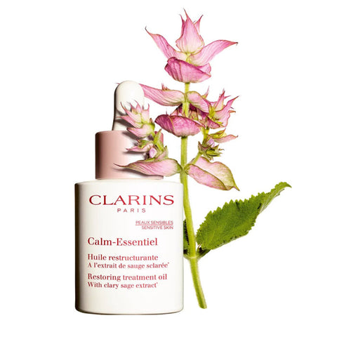 Clarins Calm-Essentiel Restoring Treatment Oil 30ml in a clear glass bottle, designed for soothing and restoring skin.