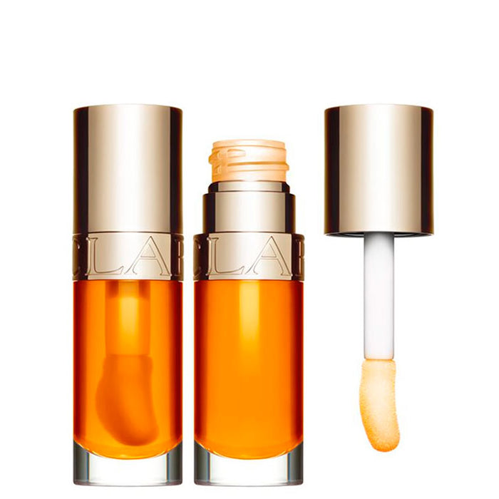 Clarins Lip Comfort Oil in shade 01 Honey, 7ml, with a glossy, nourishing lip oil from Jag Couture London - New York.