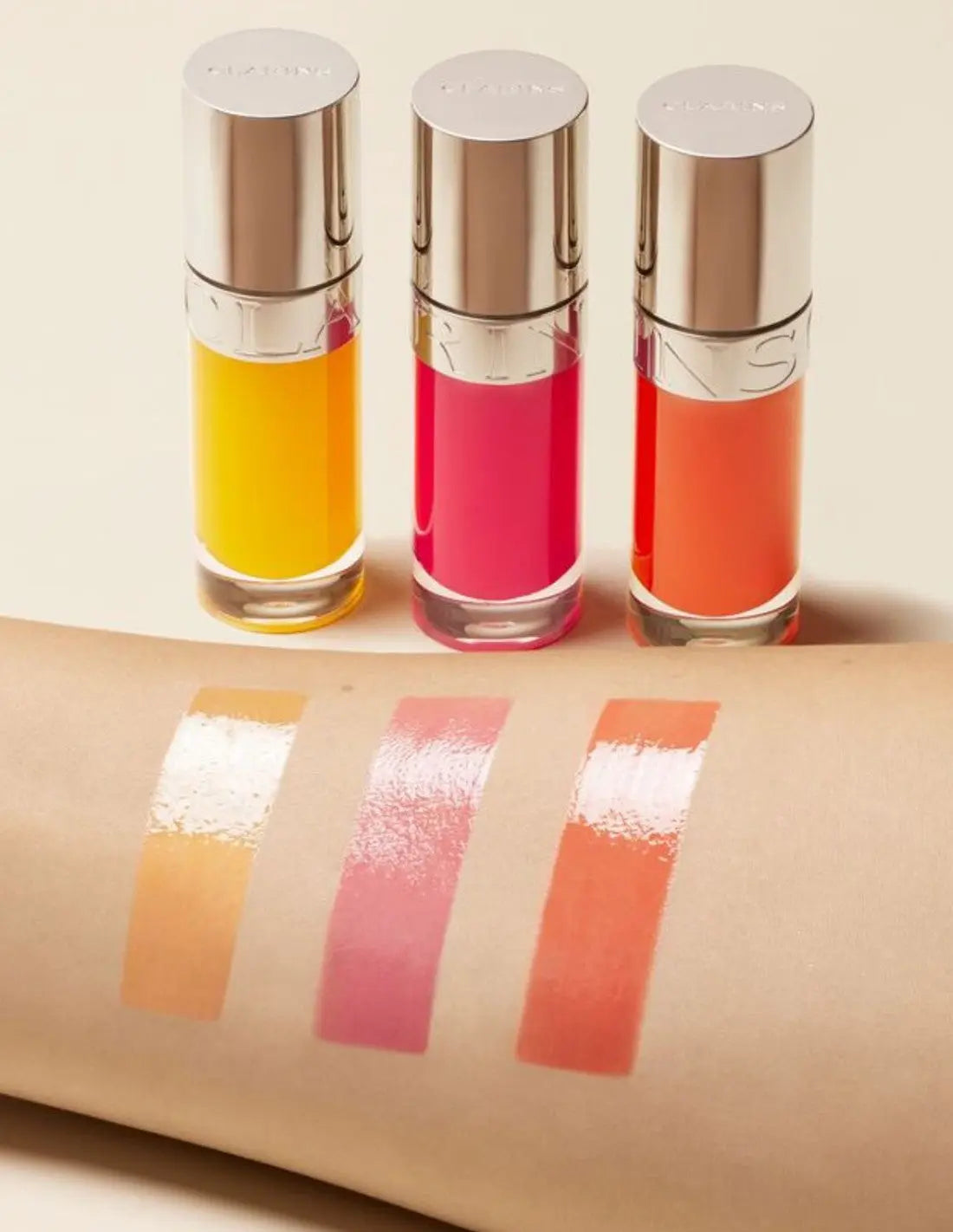 Clarins Lip Comfort Oil Power of Colors by Jag Couture London, 7ml, showing the sleek lip oil bottle with colorful packaging