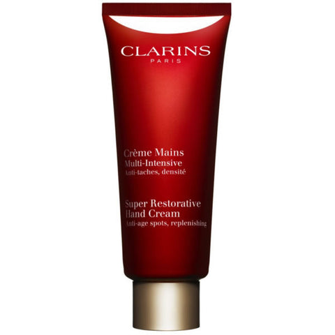 Jag Couture London New York Clarins Super Restorative Age-Control Hand Cream in 100ml tube, featuring a sleek packaging design.