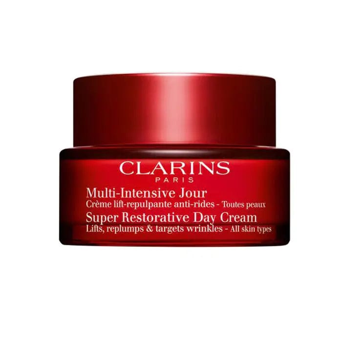 Clarins Super Restorative Day Cream for all skin types in a 50ml jar, displayed with cream texture and elegant packaging.