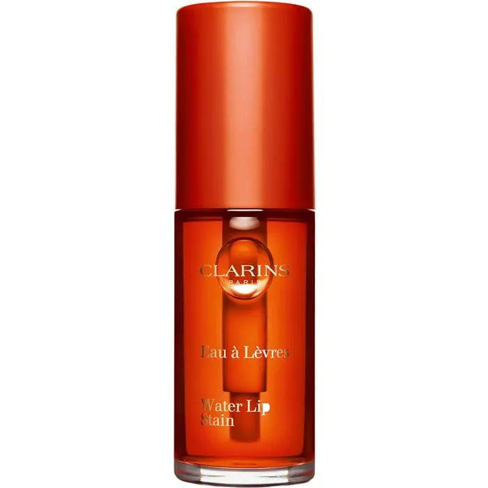 Clarins Water Lip Stain in shade 02 Orange Water, a vibrant lip color from Jag Couture London - New York.