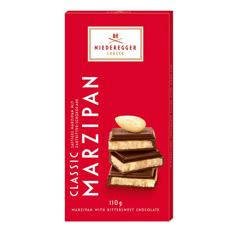 Dark chocolate covered marzipan bar by Jag Couture London New York, showing a close-up of the glossy, rich confection.