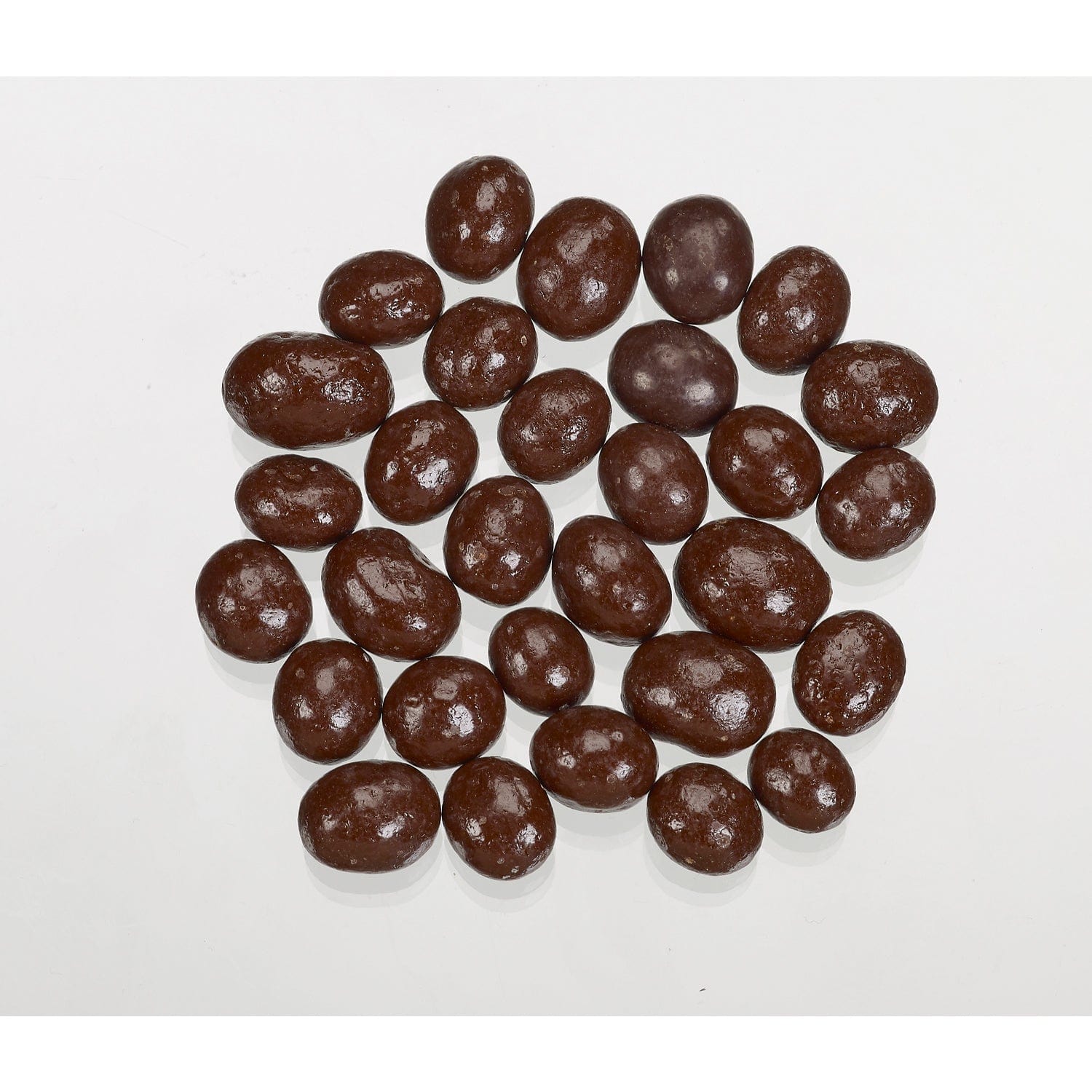 Dark chocolate covered coffee beans by Jag Couture London New York, showing glossy coating and coffee bean interior.