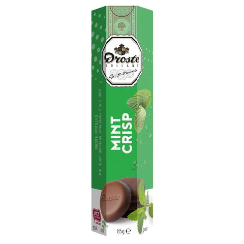 Dark chocolate mint crisp pastilles in a tube by Jag Couture London - New York, showcasing the chocolate candies inside the packaging.