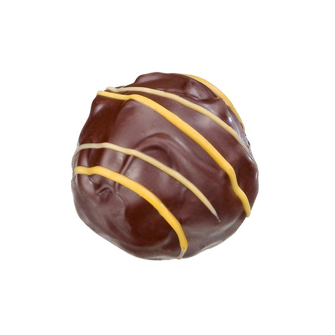 Dark orange truffle with orange ganache from Jag Couture London New York, showing a glossy, rich chocolate confection.