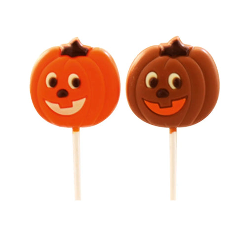 Decorated milk chocolate and orange-colored white chocolate pumpkin lollies by Jag Couture London - New York, 12 of each.