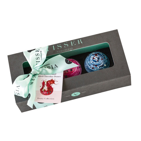Deluxe gift box of 3 fruity Picasso chocolates from Jag Couture London - New York, with menu tag, showcasing colorful chocolate art.