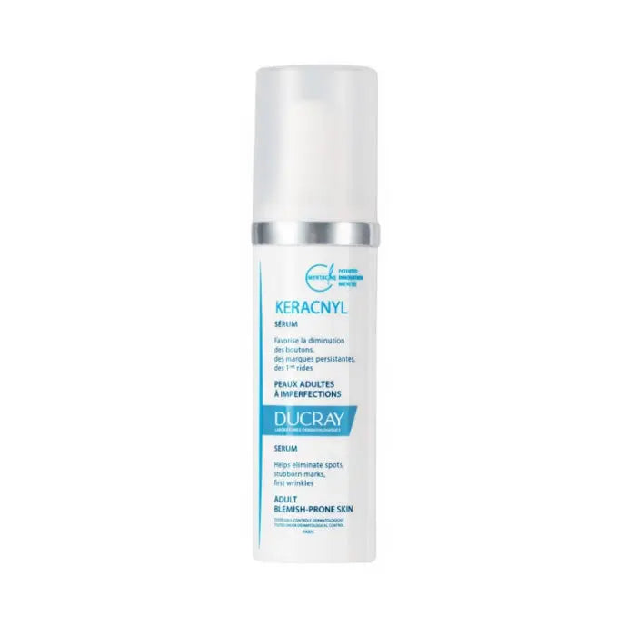 Ducray Keracnyl Serum 30ml in a clear glass bottle with a pump, displayed on a white background.